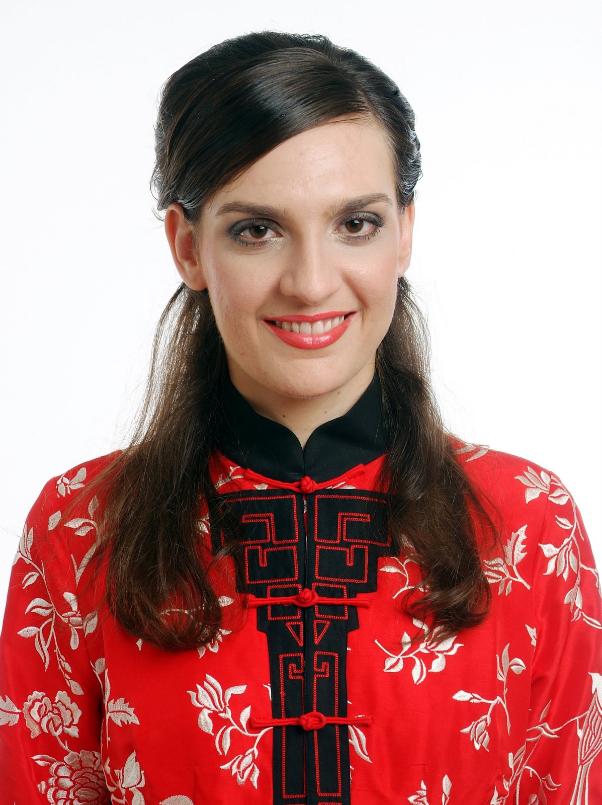 Jocelyn wearing a Qing-dynasty-style red jacket with white embroidered flourishes
